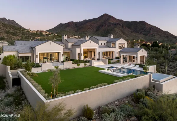 a front view of a house with a garden and porch