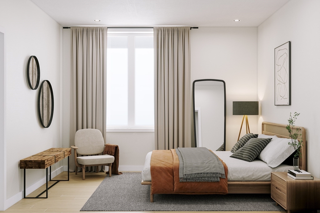 25 Adams Circle, Unit B Devens, MA 01434 - Photo 17 of 22 a bedroom with a bed chair and a window