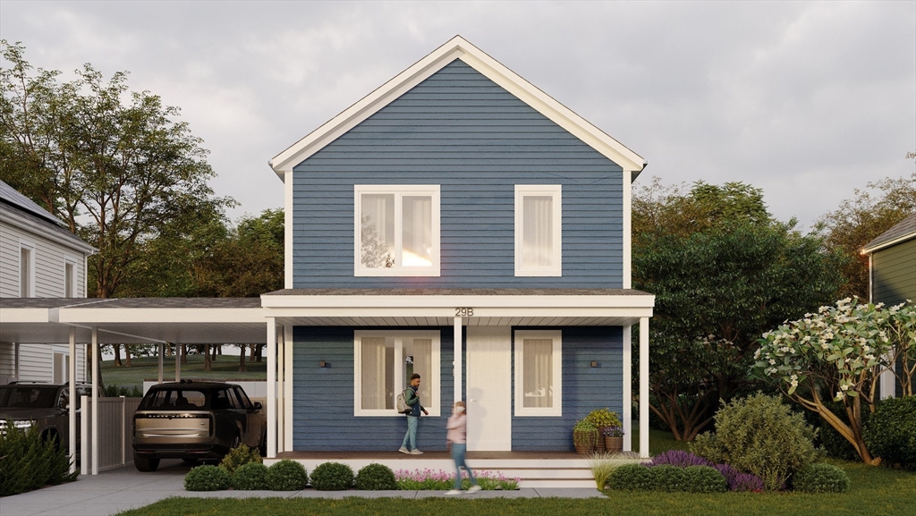 25 Adams Circle, Unit B Devens, MA 01434 - Photo 2 of 22 a front view of a house with a yard