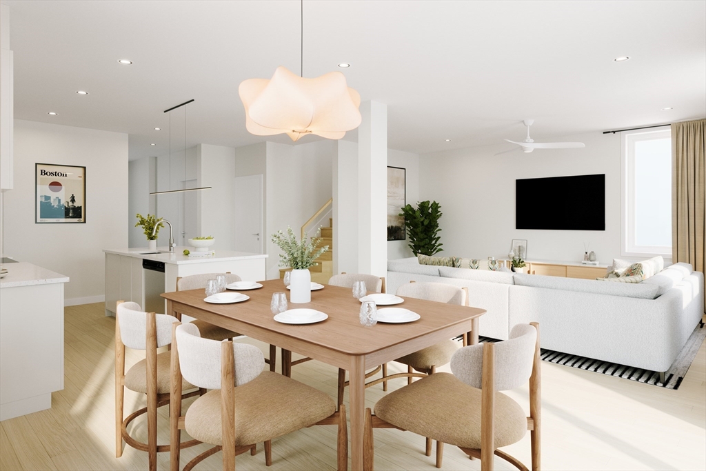 25 Adams Circle, Unit B Devens, MA 01434 - Photo 4 of 22 a view of a dining room with furniture and wooden floor