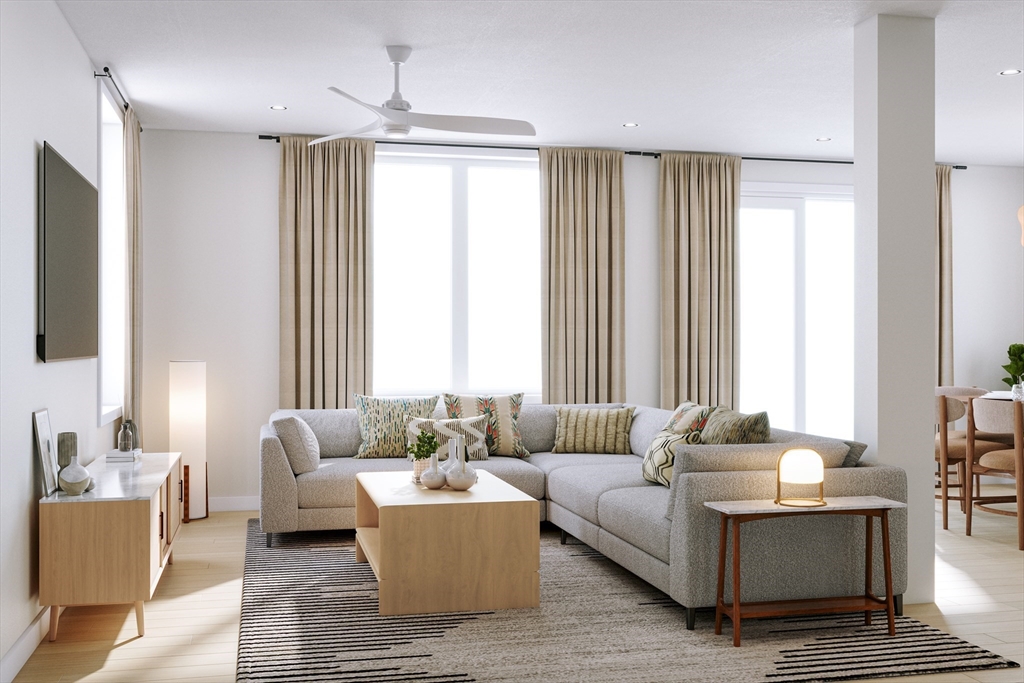 25 Adams Circle, Unit B Devens, MA 01434 - Photo 7 of 22 a living room with furniture and a large window