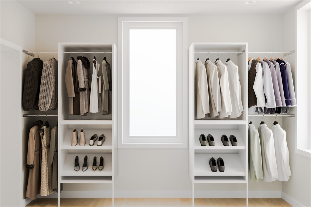 25 Adams Circle, Unit B Devens, MA 01434 - Photo 10 of 22 a view of walk in closet with clothes and shoes