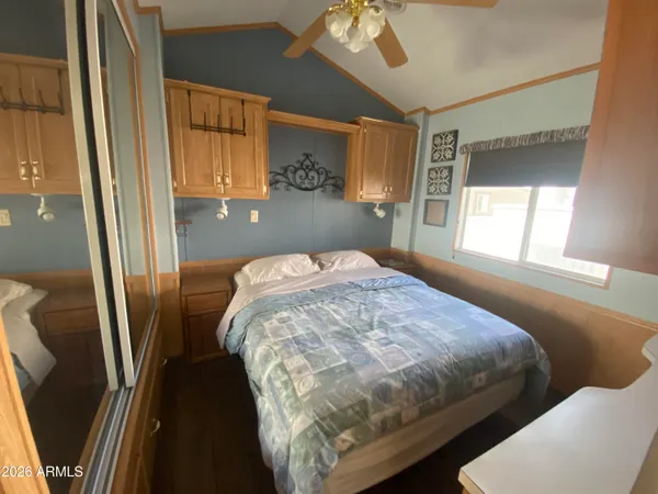 a bedroom with a bed and window