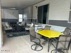 a view of a dining room with table and chairs