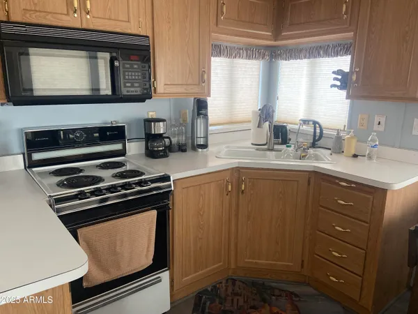 a kitchen with a stove and a microwave