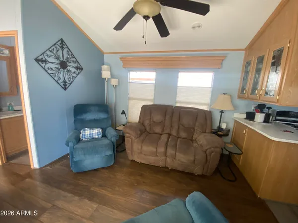 a living room with furniture and a large window