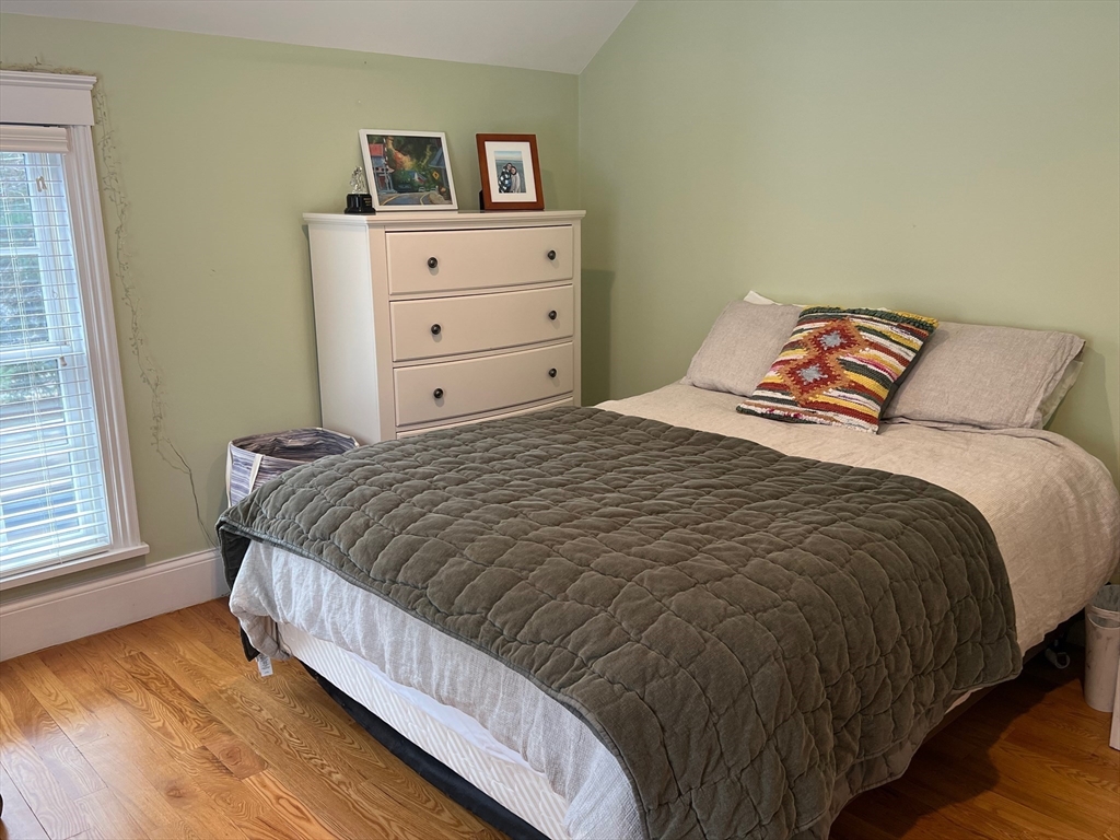601 Lexington Road Concord, MA 01742 - Photo 11 of 16 a bedroom with a bed and window