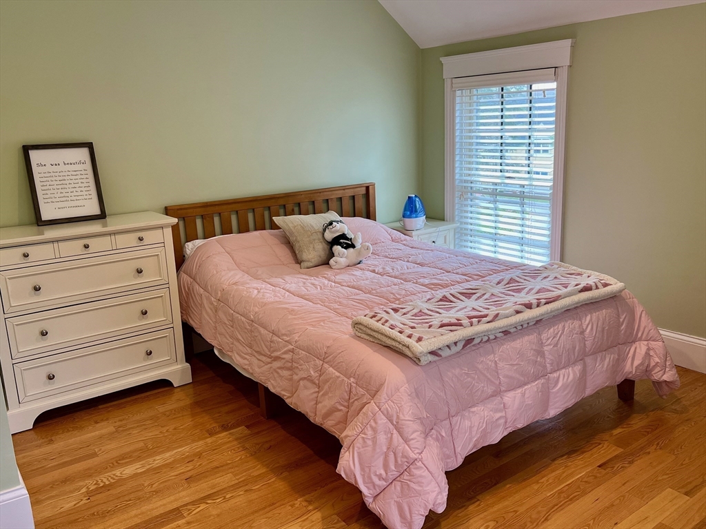 601 Lexington Road Concord, MA 01742 - Photo 12 of 16 a bedroom with a bed and a window