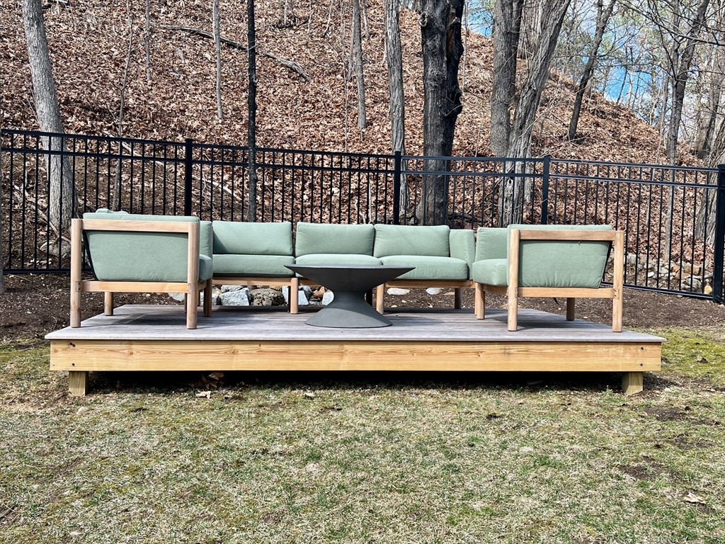 601 Lexington Road Concord, MA 01742 - Photo 15 of 16 a view of a swimming pool with outdoor seating