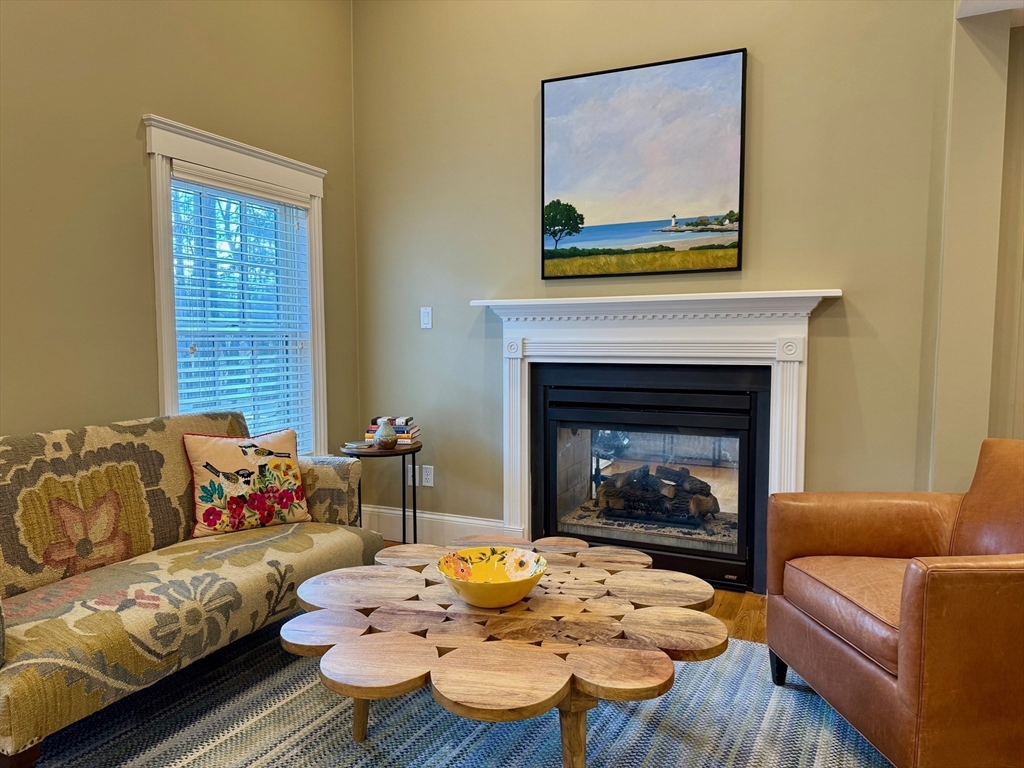 601 Lexington Road Concord, MA 01742 - Photo 4 of 16 a living room with furniture and a fireplace