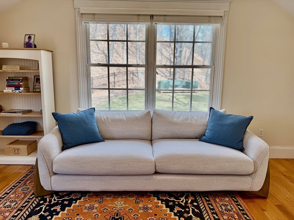 601 Lexington Road Concord, MA 01742 - Photo 9 of 16 a living room with a couch and a large window