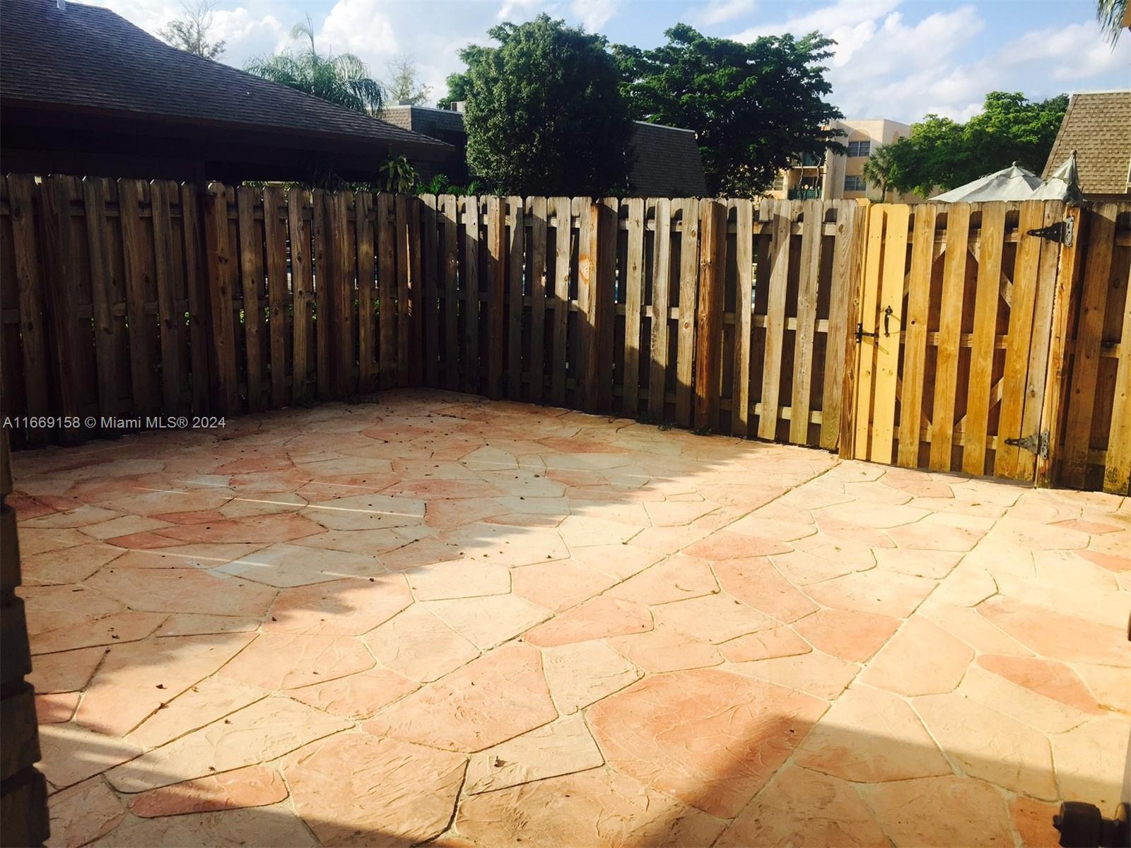 8205 Southwest 23rd Court, Unit 21A North Lauderdale, FL 33068 - Photo 23 of 23 a view of wooden fence