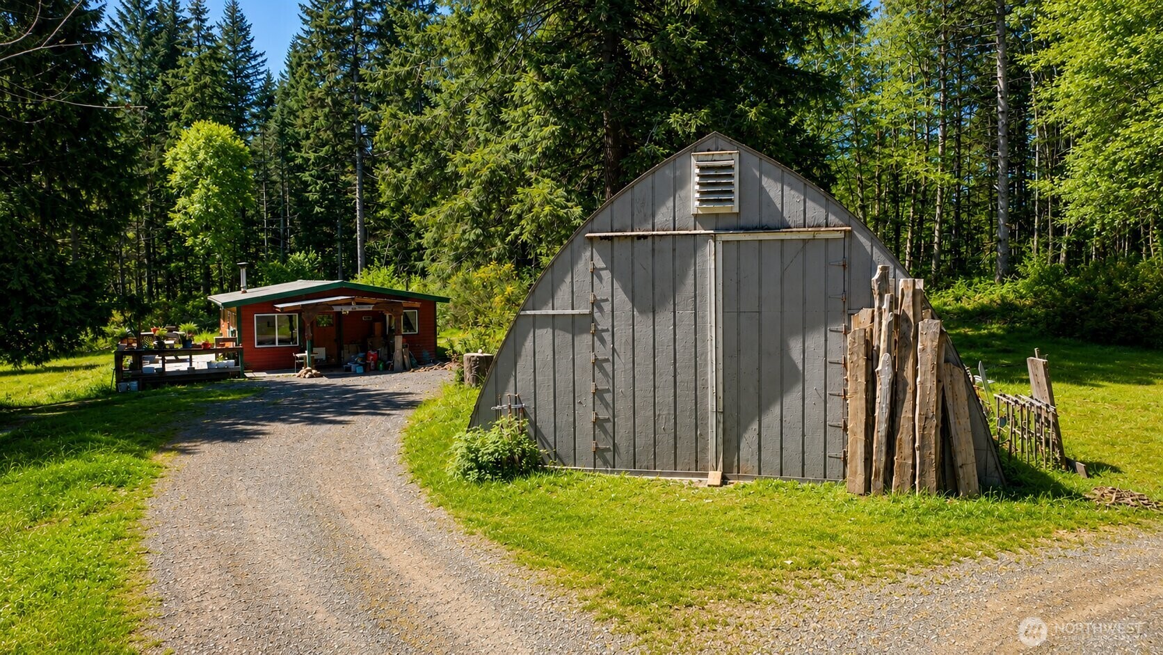 231 East Strong Road Shelton, WA 98584 - Photo 5 of 13 a front view of a house with garden