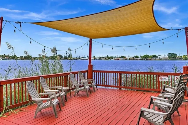 a view of a two chairs on the roof deck