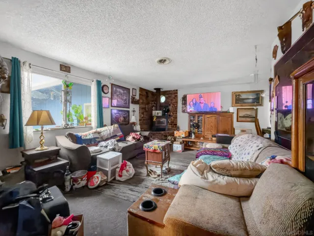 a living room with lots of furniture and a flat screen tv