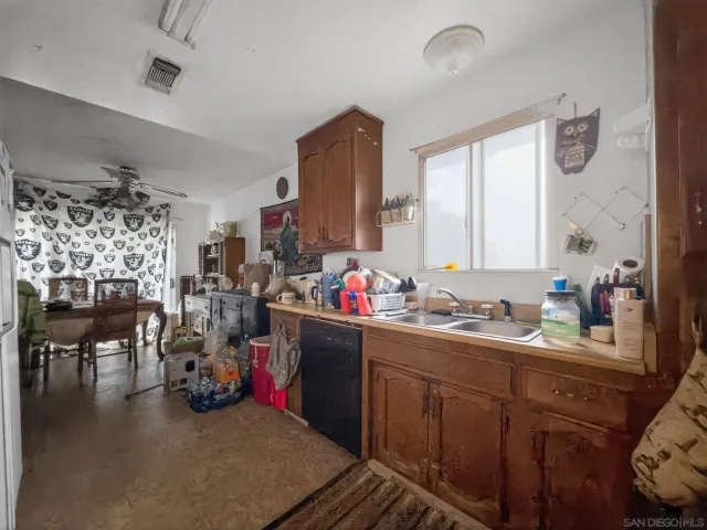 a kitchen with sink cabinets and stove