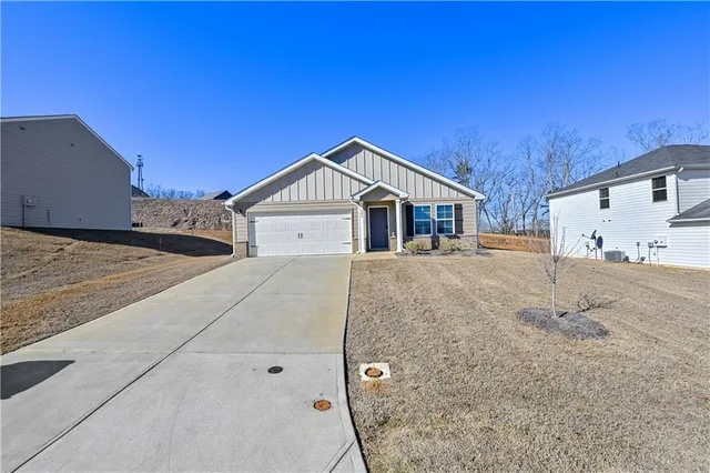 a view of a hallway with a livingroom and a dinning area
