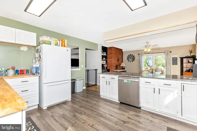 a view of a bedroom with furniture and windows