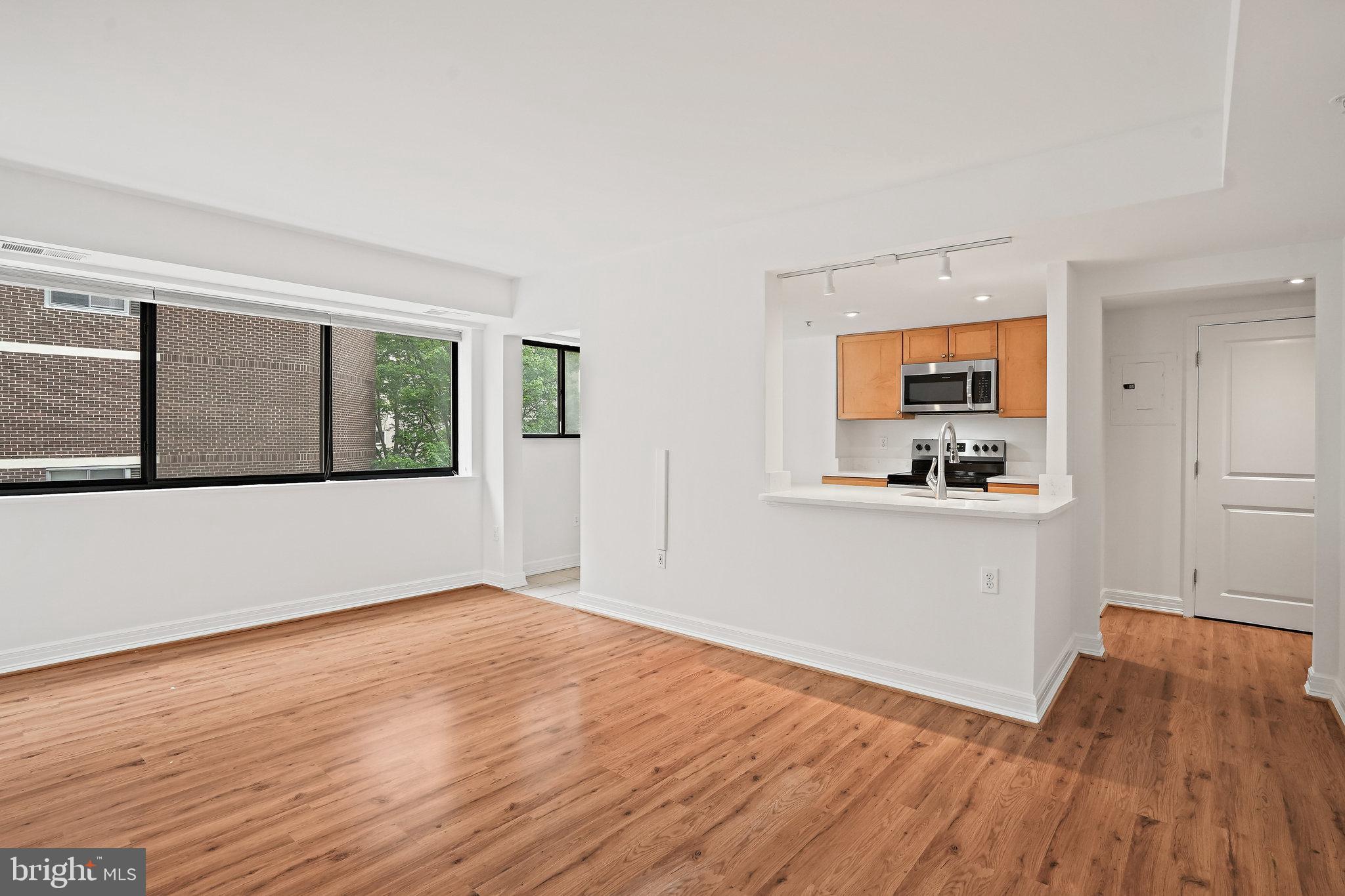 1225 13th Street Northwest, Unit 306 Washington, DC 20005 - Photo 4 of 23 Living area with kitchen island