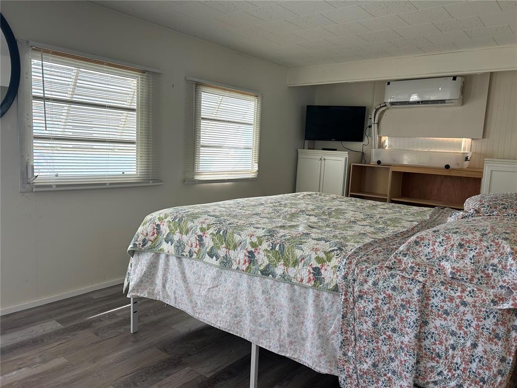 5325 Boca Raton Avenue Sarasota, FL 34234 - Photo 12 of 50 a bedroom with a bed and a flat screen tv