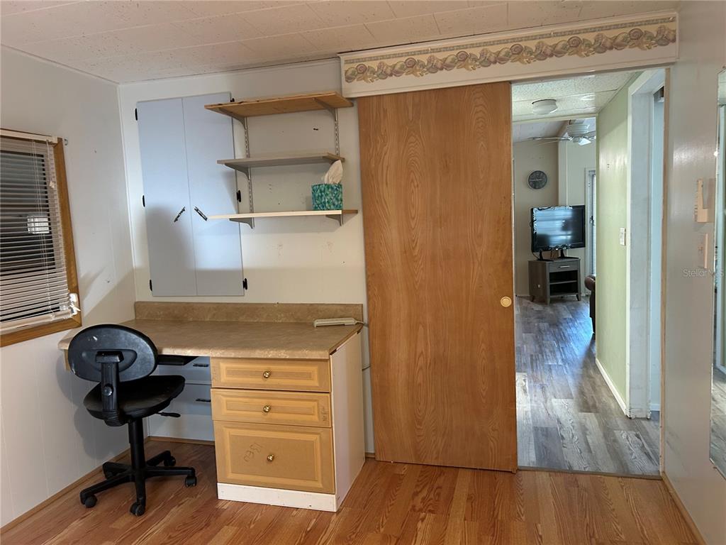 5325 Boca Raton Avenue Sarasota, FL 34234 - Photo 14 of 50 a view of hallway with wooden floor and cabinet