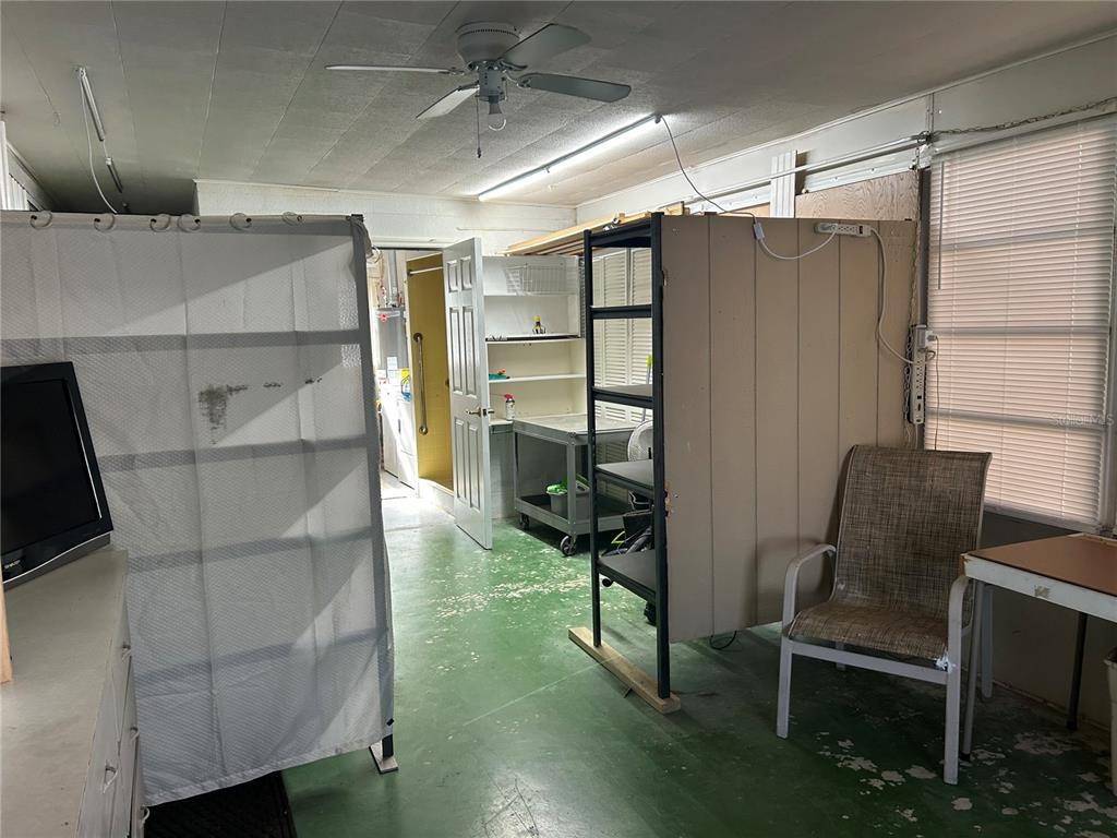 5325 Boca Raton Avenue Sarasota, FL 34234 - Photo 19 of 50 a bathroom with a window and a chair