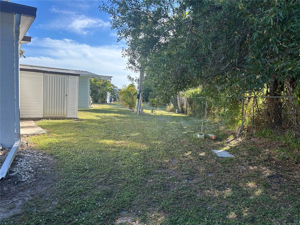 5325 Boca Raton Avenue Sarasota, FL 34234 - Photo 27 of 50 a view of a backyard with large trees