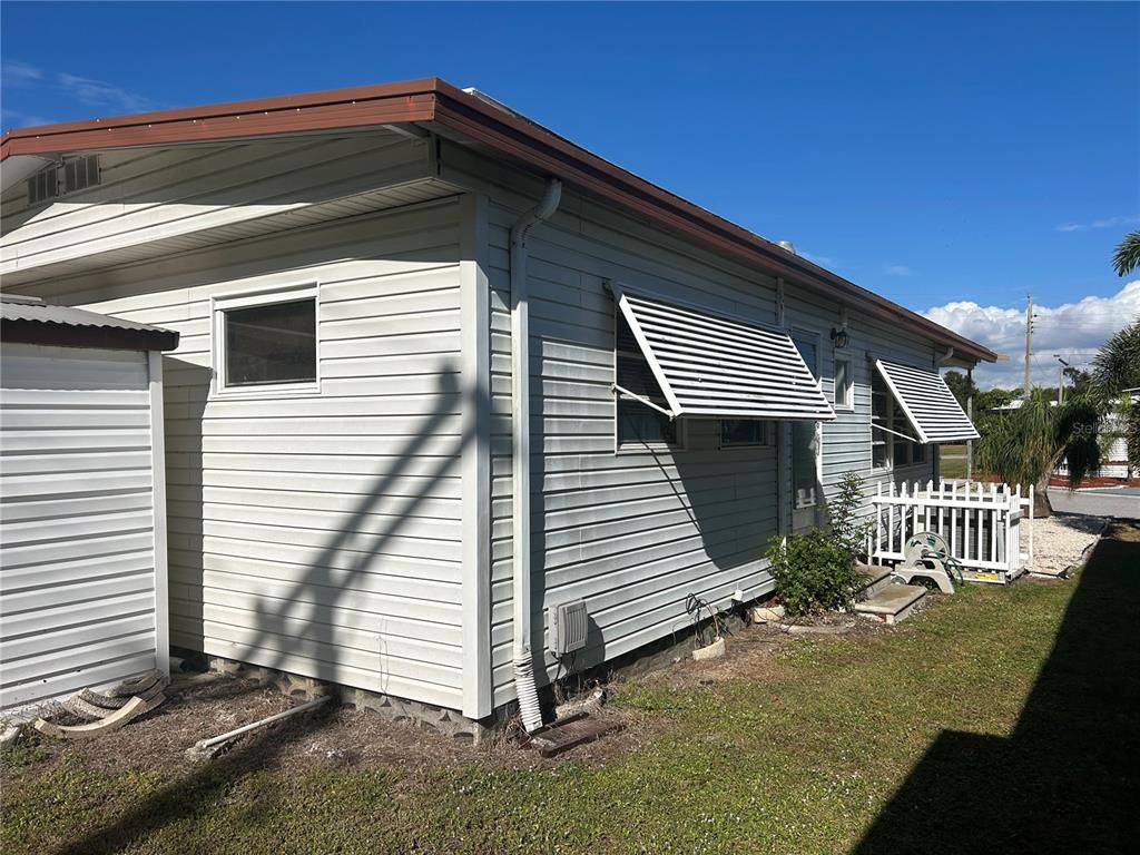 5325 Boca Raton Avenue Sarasota, FL 34234 - Photo 29 of 50 a front view of a house with stairs