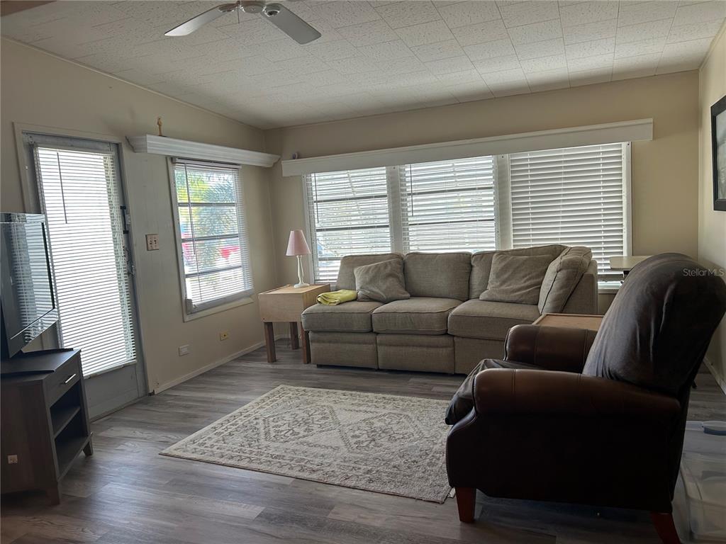 5325 Boca Raton Avenue Sarasota, FL 34234 - Photo 4 of 50 a living room with furniture and a flat screen tv