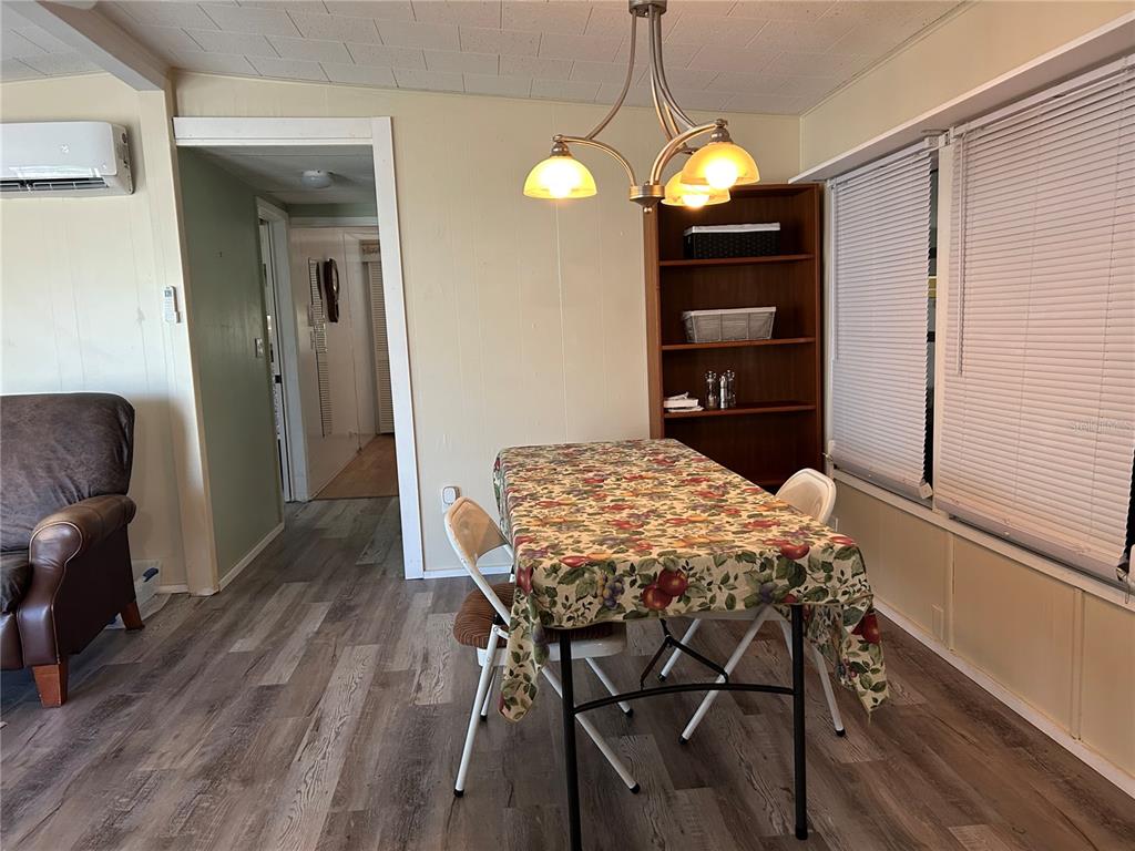 5325 Boca Raton Avenue Sarasota, FL 34234 - Photo 10 of 50 a dining room with furniture and wooden floor