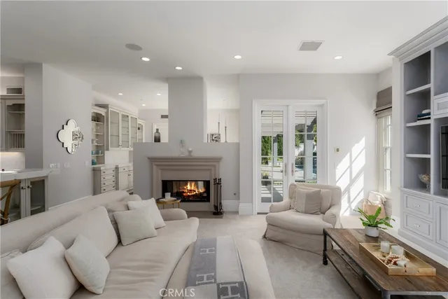 a kitchen with stainless steel appliances granite countertop a sink a stove a refrigerator and island