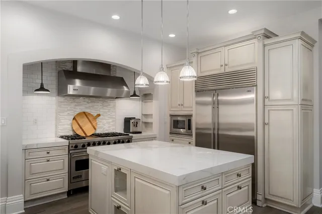 a spacious bedroom with a bed and a fireplace