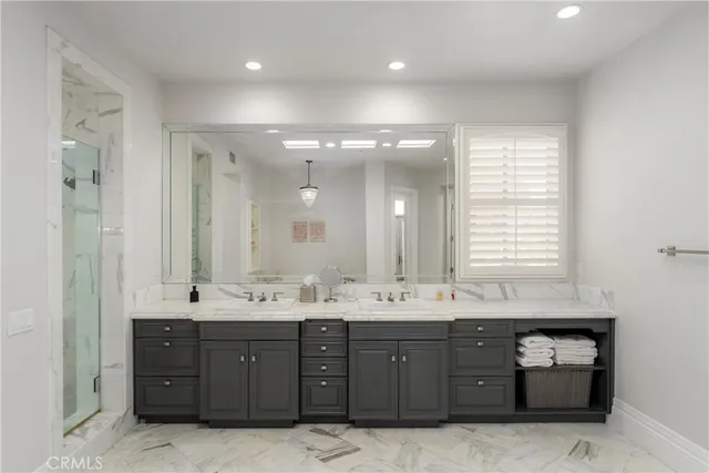 a kitchen that has a sink and a stove in it