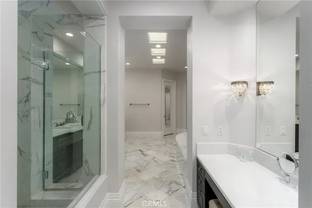 a bedroom with 2 bed and a couch