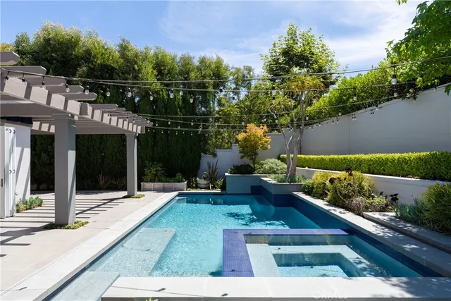 a view of a house with a yard and furniture
