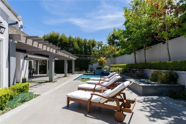 a view of a white building with a sink and porch