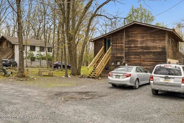 a view of a car in front of a house
