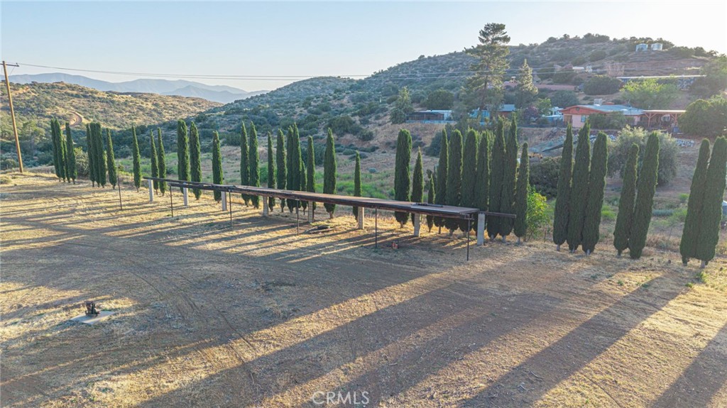6780 Hubbard Road Acton, CA 93510 - Photo 14 of 36 a view of a road with a backyard of a house