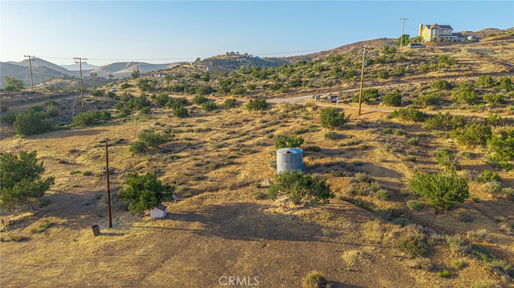 6780 Hubbard Road Acton, CA 93510 - Photo 17 of 36 a view of a large building with mountains in the background