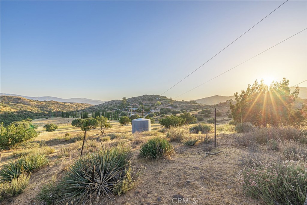 6780 Hubbard Road Acton, CA 93510 - Photo 20 of 36 a view of a lake with mountains in the background