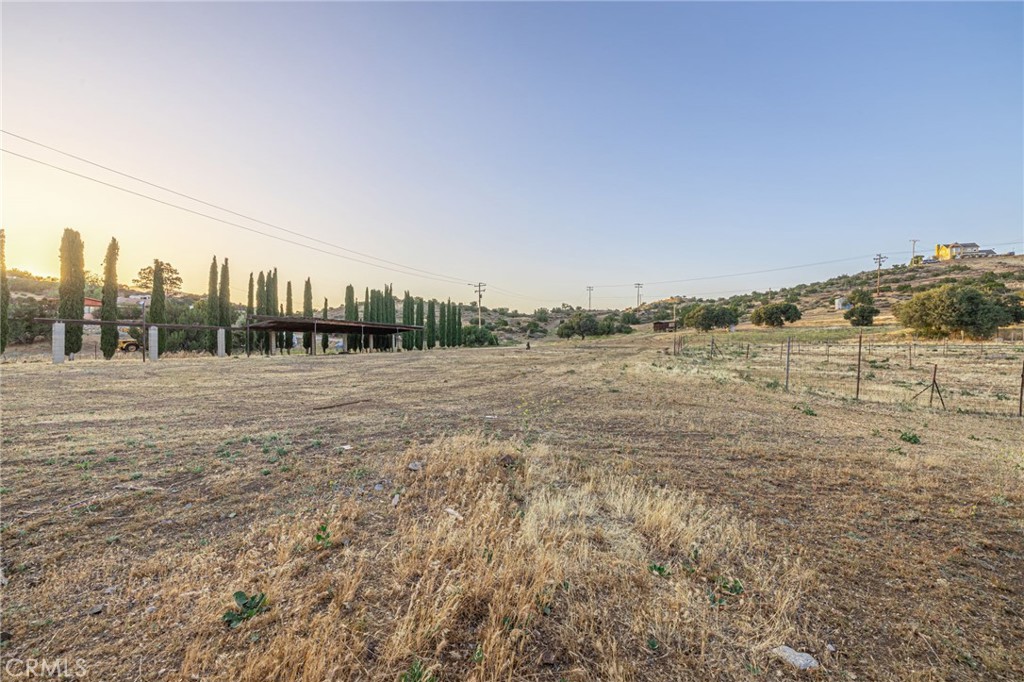 6780 Hubbard Road Acton, CA 93510 - Photo 29 of 36 a view of a field with trees in background