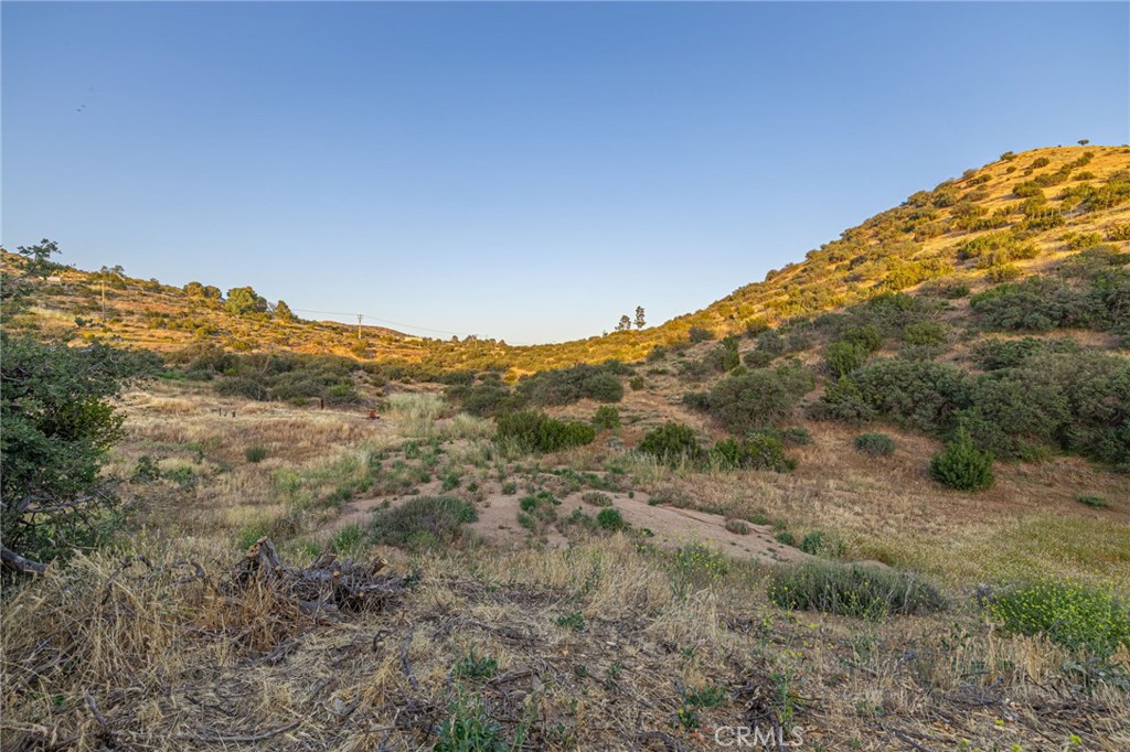 6780 Hubbard Road Acton, CA 93510 - Photo 30 of 36 a view of a large mountain with mountains in the background