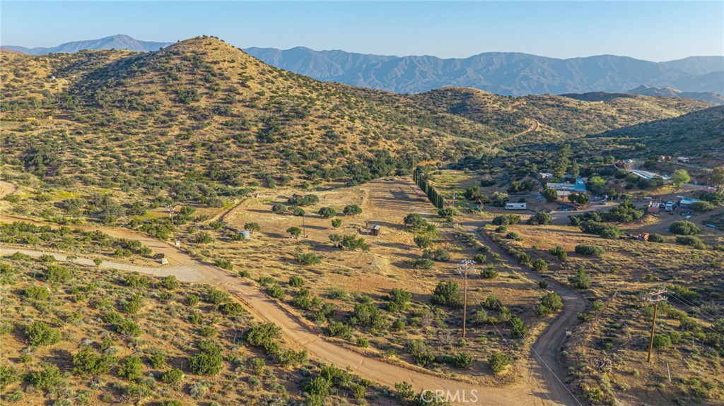 6780 Hubbard Road Acton, CA 93510 - Photo 4 of 36 a view of a large mountain with mountains in the background
