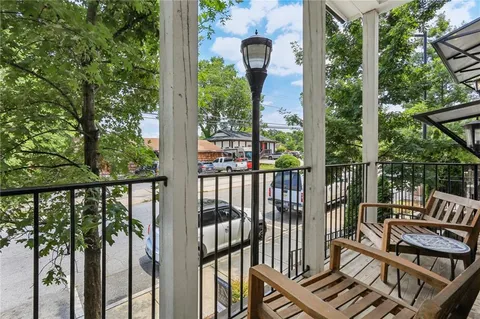 a view of a balcony with wooden floor