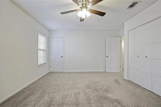 a view of an empty room and window