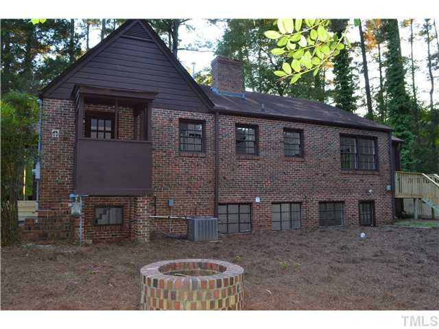 2524 Pickett Road Durham, NC 27705 - Photo 18 of 20 Exterior back of home shows the brick fire pit. This home has a new heat pump, a new deck and a new privacy fence. Low maint. brick exterior. Exterior Back