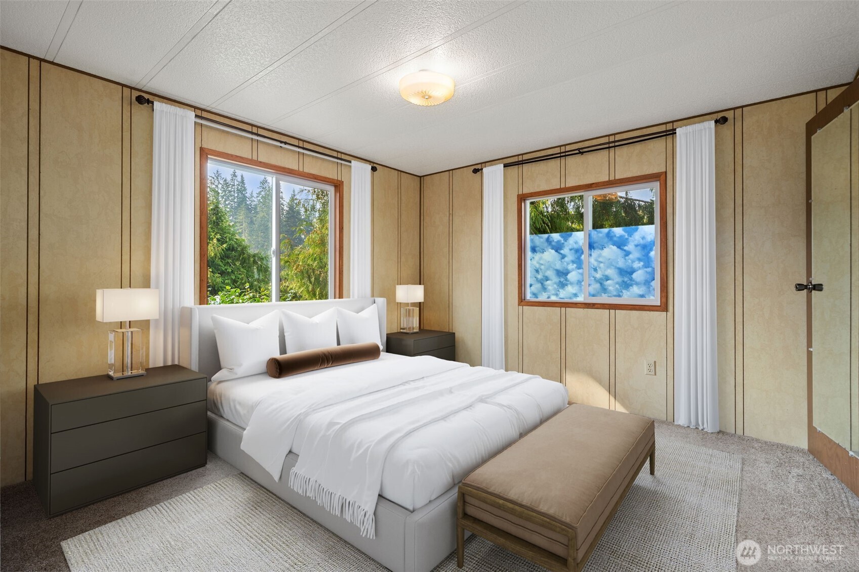 1171 E Trail Belfair, WA 98528 - Photo 8 of 29 a bedroom with a bed and a painting on the wall