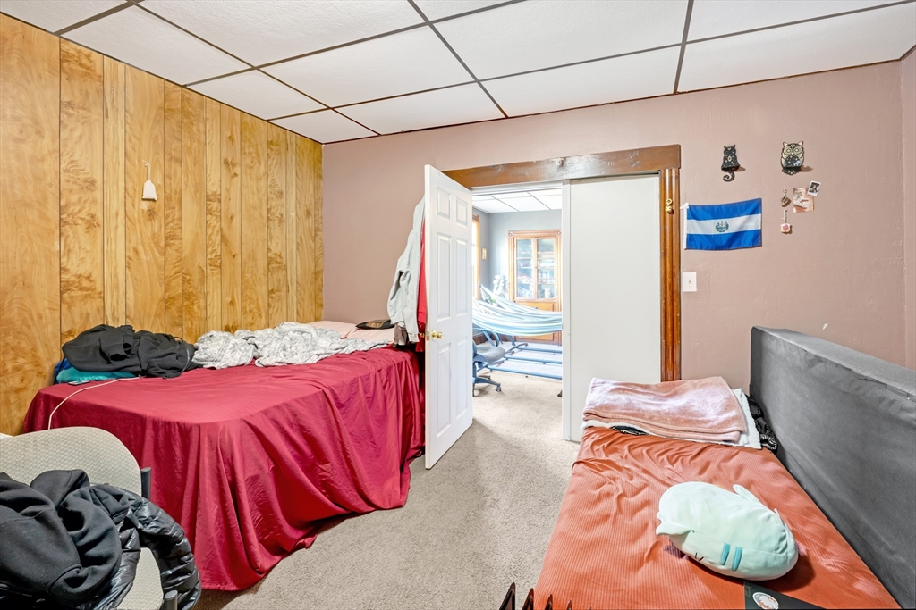 14 Mendon Street Worcester, MA 01604 - Photo 13 of 17 a bedroom with a bed and a couch