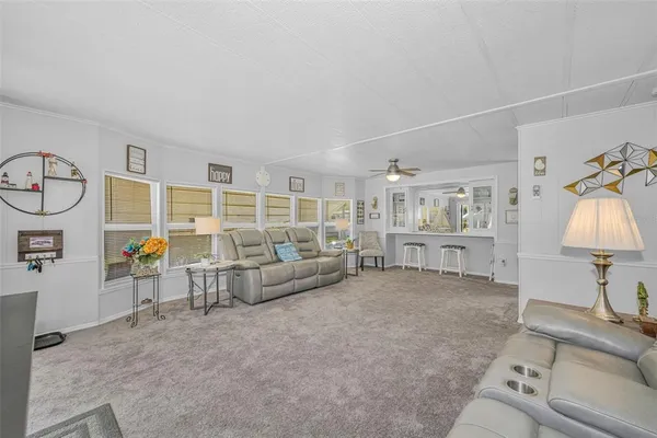 a kitchen with stainless steel appliances a stove microwave and refrigerator