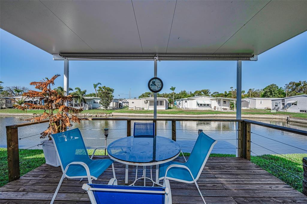 4454 Tucker Square New Port Richey, FL 34652 - Photo 33 of 64 a view of a dining room with furniture window and wooden floor